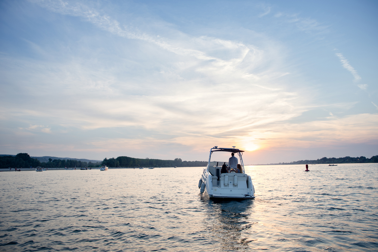 Family cruising together on a lake boat