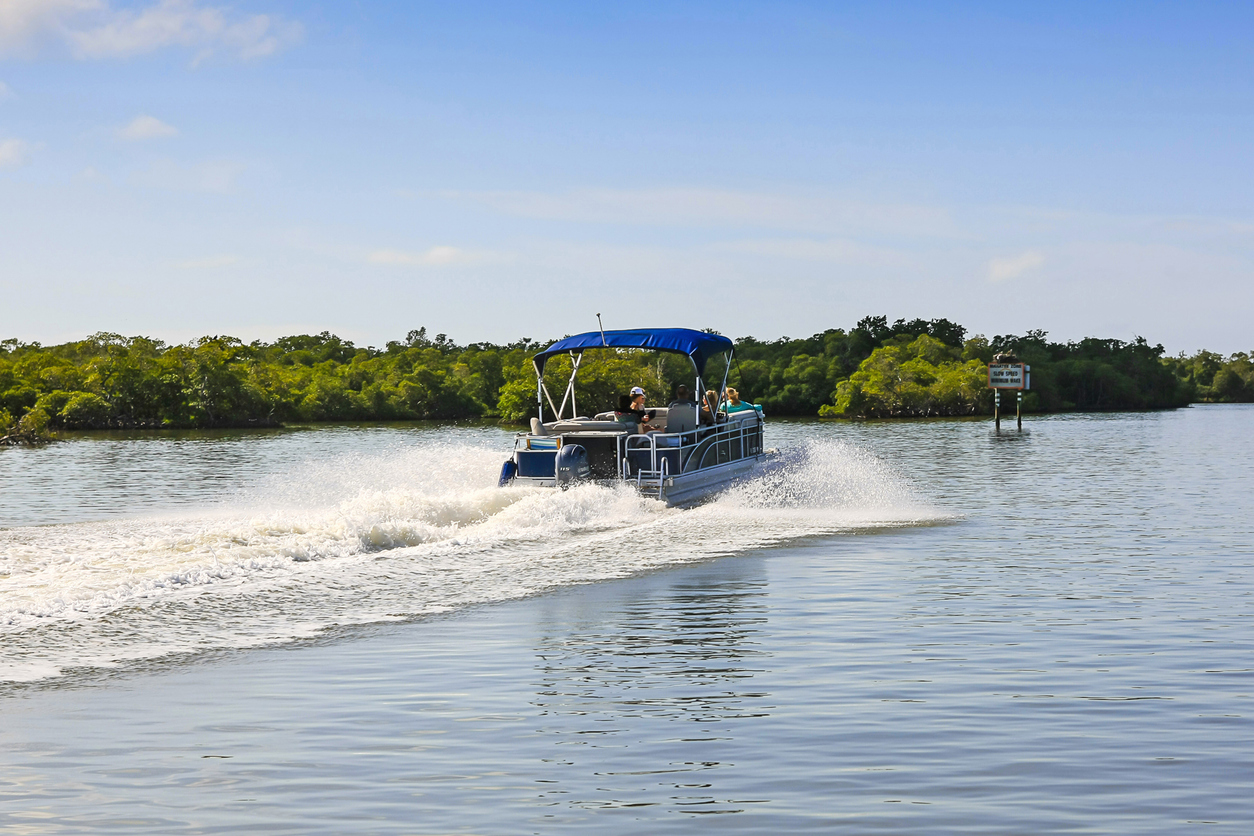 Pontoon boat cruising on calm water